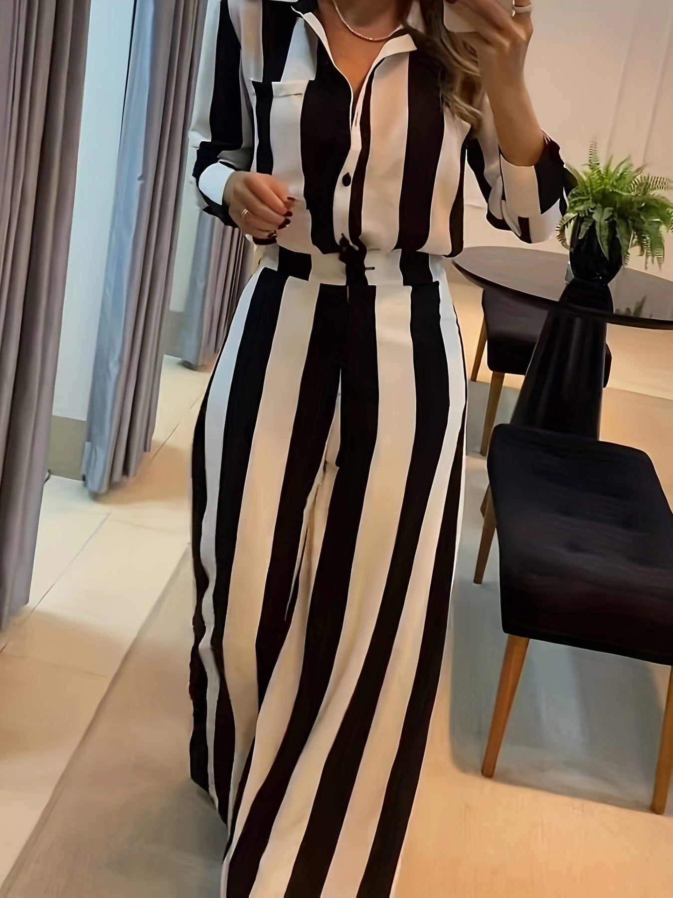 A Two-Piece Set Featuring a Stylish Black And White Striped Shirt with Button Pocket Design And Wide-Leg Pants for Autumn Leisure.